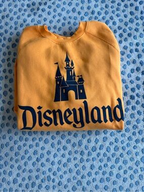 Disneyland 70th Anniversary Orange Crewneck Sweatshirt.